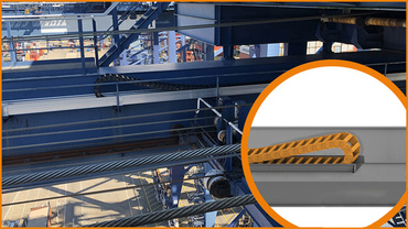 Installation d'une chaîne porte-câbles sur le côté de la poutre du pont